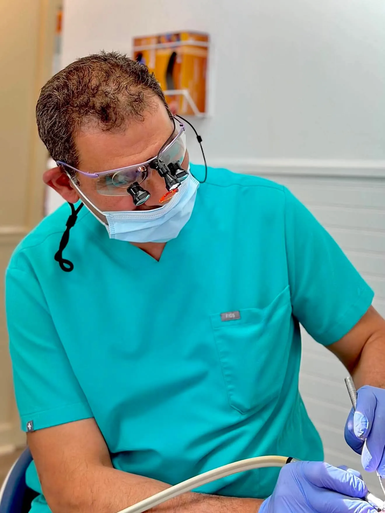Dr. Mohamed Elghannam providing hands-on dental care